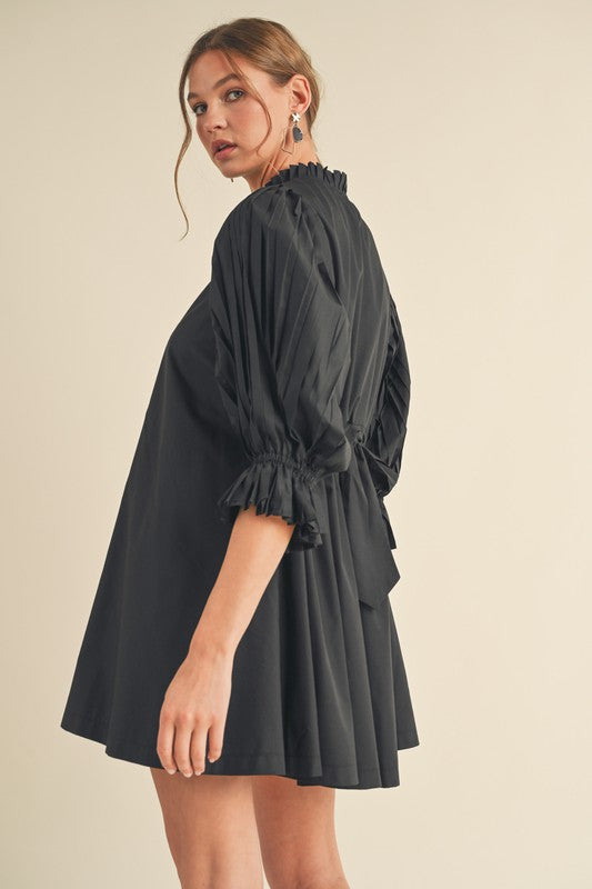 long sleeve, black pleated mini dress